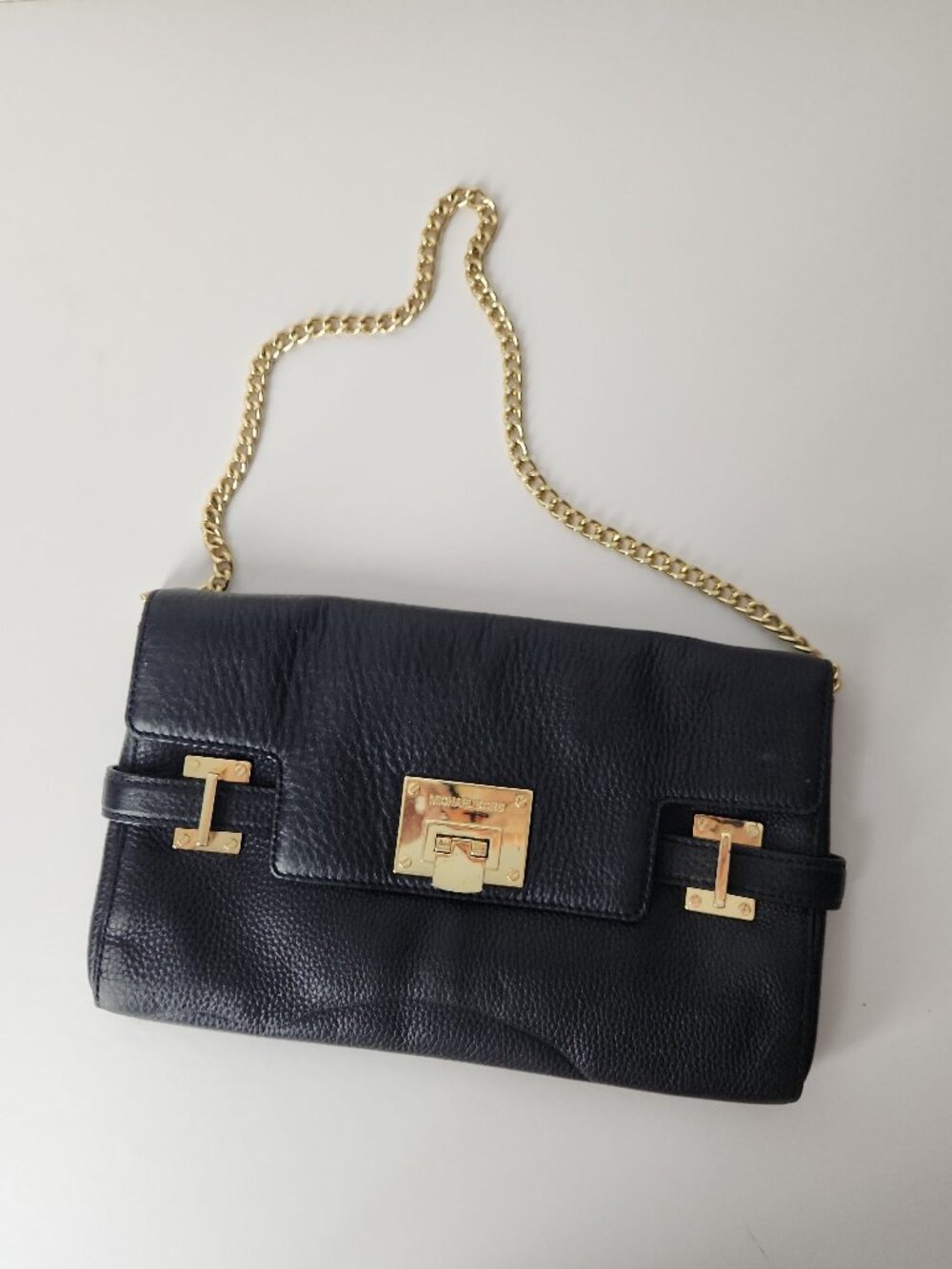 Michael Kors Astrid black pebbled leather clutch bag gold chain shoulder strap